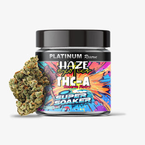 Jar of Platinum Reserve Haze Exotics THC-A Super Soaker with a clump of cannabis next to it on a white background